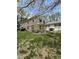 Charming two-story home with a well-manicured lawn, patio, and brick and siding details at 4402 Mountbatten Ct, Indianapolis, IN 46254