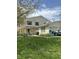 Charming two-story home with a well-manicured lawn, patio, and brick and siding details at 4402 Mountbatten Ct, Indianapolis, IN 46254