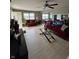 Open concept living room with a dining area and a neutral palette, enhanced by natural light and comfortable seating at 4402 Mountbatten Ct, Indianapolis, IN 46254