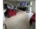 Inviting living room with a staircase, television, and comfortable seating, perfect for relaxation and entertainment at 4402 Mountbatten Ct, Indianapolis, IN 46254