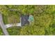 Aerial view of property featuring mature trees, pool, and ample parking at 4475 Berkshire Rd, Indianapolis, IN 46226