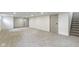 Spacious finished basement offers recessed lighting, neutral carpet, and white walls at 4475 Berkshire Rd, Indianapolis, IN 46226