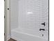 Bright bathroom shows white subway tile, and black plumbing fixtures at 4475 Berkshire Rd, Indianapolis, IN 46226