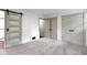 Bright bedroom with neutral carpet, and modern doors at 4475 Berkshire Rd, Indianapolis, IN 46226