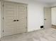 Neutral bedroom features large closet doors, neutral carpet and white trim at 4475 Berkshire Rd, Indianapolis, IN 46226