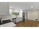 Modern kitchen featuring quartz countertops, stainless steel appliances, and white cabinetry at 4475 Berkshire Rd, Indianapolis, IN 46226