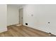 Mudroom features wood-look floors and white trim at 4475 Berkshire Rd, Indianapolis, IN 46226