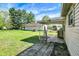 Spacious backyard with a detached garage and covered patio, perfect for outdoor entertaining and relaxation at 4941 Mathews Ave, Indianapolis, IN 46227