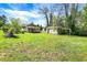 Open backyard featuring a detached garage and playset, perfect for families, and a storage shed at 4941 Mathews Ave, Indianapolis, IN 46227