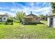 Home exterior with garage features a well-maintained lawn and partial view of nearby residential areas at 4941 Mathews Ave, Indianapolis, IN 46227