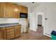 This kitchen has wood cabinets, laminate countertops, and a doorway into another room at 4941 Mathews Ave, Indianapolis, IN 46227