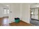 The living room features beautiful wood floors, multiple doorways, and bright natural light at 4941 Mathews Ave, Indianapolis, IN 46227