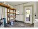 Functional storage room with shelving and access to the backyard, providing ample space for organizing belongings at 4941 Mathews Ave, Indianapolis, IN 46227