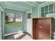 Cozy sunroom featuring bright, natural light and neutral flooring, a perfect spot for relaxation at 4941 Mathews Ave, Indianapolis, IN 46227