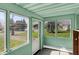 Inviting sunroom with multiple windows providing abundant natural light and views of the outdoors at 4941 Mathews Ave, Indianapolis, IN 46227