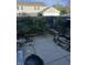 Backyard with a stone water feature, wooden fence, and patio area for outdoor enjoyment at 4984 W 59Th St, Indianapolis, IN 46254
