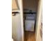 Cozy laundry room featuring a stacked washer and dryer, complemented by a charming 'Laundry Co.' sign at 4984 W 59Th St, Indianapolis, IN 46254