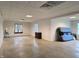 Spacious basement with concrete floors, windows, and paneled ceiling provides ample natural light and storage at 515 E Hoover Dr, Nineveh, IN 46164