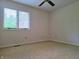 Bright bedroom has plush carpeting and a window at 515 E Hoover Dr, Nineveh, IN 46164