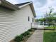 Side view of a home featuring vinyl siding and a walkout deck with lakeside views at 515 E Hoover Dr, Nineveh, IN 46164