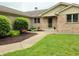Well-manicured lawn and decorative landscaping leading to the front entrance at 515 E Hoover Dr, Nineveh, IN 46164