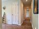 Bright hallway with decorative mirror and patterned tile flooring at 515 E Hoover Dr, Nineveh, IN 46164