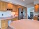 Spacious kitchen featuring stainless steel refrigerator, wooden cabinetry, and a built-in desk at 515 E Hoover Dr, Nineveh, IN 46164