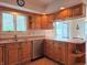 Spacious kitchen with breakfast bar, stainless steel dishwasher, and views to backyard at 515 E Hoover Dr, Nineveh, IN 46164