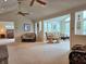Open concept living room with lots of natural light and vaulted ceiling at 515 E Hoover Dr, Nineveh, IN 46164