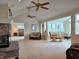 Spacious living room with stone fireplace and scenic views at 515 E Hoover Dr, Nineveh, IN 46164