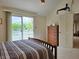 Bedroom features a private balcony, large closet, and vaulted ceiling at 515 E Hoover Dr, Nineveh, IN 46164