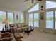 Comfortable sunroom with window views of the lake at 515 E Hoover Dr, Nineveh, IN 46164