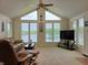 Bright sunroom with large windows offering views of the surrounding lake at 515 E Hoover Dr, Nineveh, IN 46164
