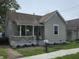 Charming single-story home featuring a cozy front porch and well-maintained landscaping at 533 W Pike St, Martinsville, IN 46151