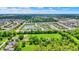 Here's an aerial view featuring a pond, common green space and similar single Gathering homes at 5580 Pintail Ln, Greenwood, IN 46143