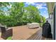 Spacious back deck featuring outdoor seating with lush green trees in the background at 5580 Pintail Ln, Greenwood, IN 46143