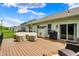Well-kept back deck with outdoor seating and grill, perfect for outdoor entertaining at 5580 Pintail Ln, Greenwood, IN 46143