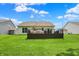 A spacious backyard featuring a charming deck, perfect for outdoor relaxation and gatherings at 5580 Pintail Ln, Greenwood, IN 46143