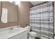 Bathroom with white vanity, updated fixtures, and modern shower curtain at 5580 Pintail Ln, Greenwood, IN 46143