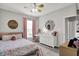 Bright bedroom with colorful decor, a ceiling fan, and feminine touches at 5580 Pintail Ln, Greenwood, IN 46143