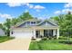 Charming two-story home with a well-manicured lawn and inviting front porch with beautiful curb appeal at 5580 Pintail Ln, Greenwood, IN 46143