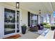 Inviting front porch with cozy seating, stylish decor, and a welcoming entryway at 5580 Pintail Ln, Greenwood, IN 46143