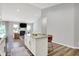 Open kitchen flows into a living area with a fireplace and couch creating a welcoming entertainment space at 5580 Pintail Ln, Greenwood, IN 46143
