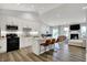 Open-concept kitchen featuring modern appliances, an island with seating, and a seamless flow to the living area at 5580 Pintail Ln, Greenwood, IN 46143