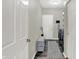 Clean and functional laundry room with storage shelving and modern washer and dryer at 5580 Pintail Ln, Greenwood, IN 46143