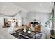 Open-concept living and dining area featuring modern furnishings and hardwood floors at 5580 Pintail Ln, Greenwood, IN 46143