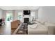 Inviting living room with a fireplace, neutral tones, and access to the outdoors at 5580 Pintail Ln, Greenwood, IN 46143