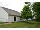 Backyard with a large tree and a black chain link fence at 5708 Outer Bank Rd, Indianapolis, IN 46239