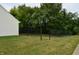 Backyard with a black chain link fence and lots of trees at 5708 Outer Bank Rd, Indianapolis, IN 46239