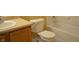 Bathroom featuring a toilet, tub, and vanity with sink at 5708 Outer Bank Rd, Indianapolis, IN 46239